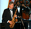 [PHOTO: Clinton playing the saxophone]