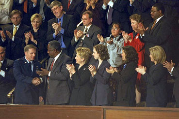 Photo: First Lady Hillary Rodham Clinton and guests applaud Captain John Cherrey.