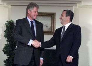 President Clinton shakes hands with Israeli Prime Minister Ehud Barak prior to their bilateral meeting.