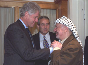 The President greets Palestinian Liberation Organization chairman Yasser Arafat at the Radisson Plaza Hotel in Oslo.