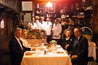 The President and the First Lady enjoy a private dinner with President and Mrs. Jacques Chirac at L'Amis Louis in Paris.