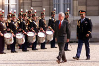 The President reviews the troops at Elysee Palace.