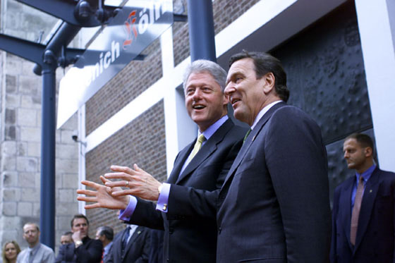 President Clinton and Chancellor Schroeder of Germany greet a cheering crowd at the Gürzenich, a cultural center in Cologne.