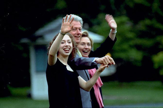 The President, First Lady, and Chelsea wave goodbye on the South Lawn of the White House.