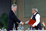 President Clinton and Prime Minister Atal Bihari Vajpayee shake hands after signing a vision statement, Hyderabad House, New Delhi.