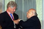 President Demirel presents President Clinton with the Turkish State Award in a ceremony at the Presidential Palace