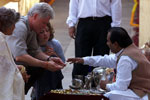 The President and Chelsea Clinton look at wares from local craftsmen at the Amber Fort.
