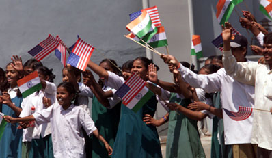 Children enthusiastically welcome President Clinton as he makes his way to the Mahavir Trust Hospital. Hyderabad, India.