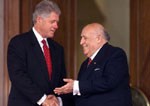 President Demirel shakes hands with President Clinton after their remarks during the arrival ceremony at the Presidential Palace.