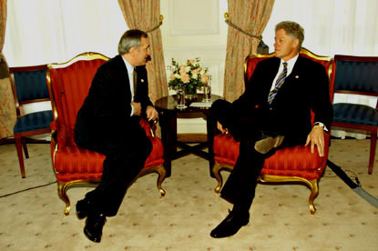 Prime Minister Ahern and President Clinton engage in a bilateral meeting.