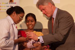 The President administers polio immunization to Sandhya with the assistance of her mother and Dr. Bitragunta Sailaja at Mahavir Trust Hospital.  Hyderabad, India.