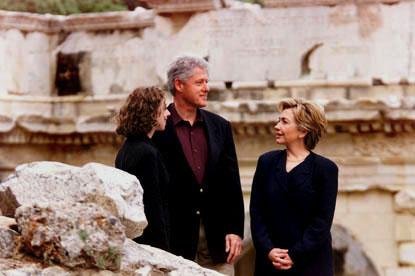 The Clintons pause to take in their surroundings.