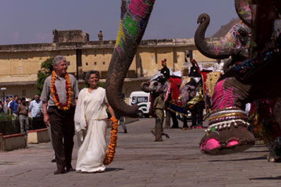 President Clinton and Minister of State, Tourism, Art and Culture Bina Kak pass a cordon of elephants at the Amber Fort.